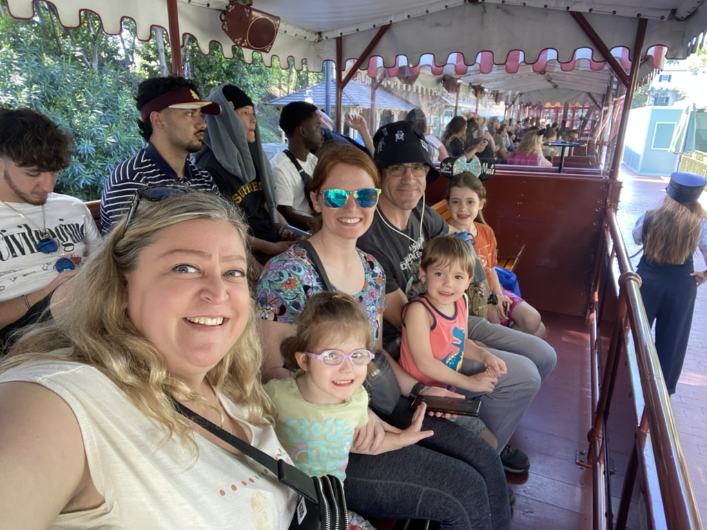 Family at Disneyland riding the Disney Train.